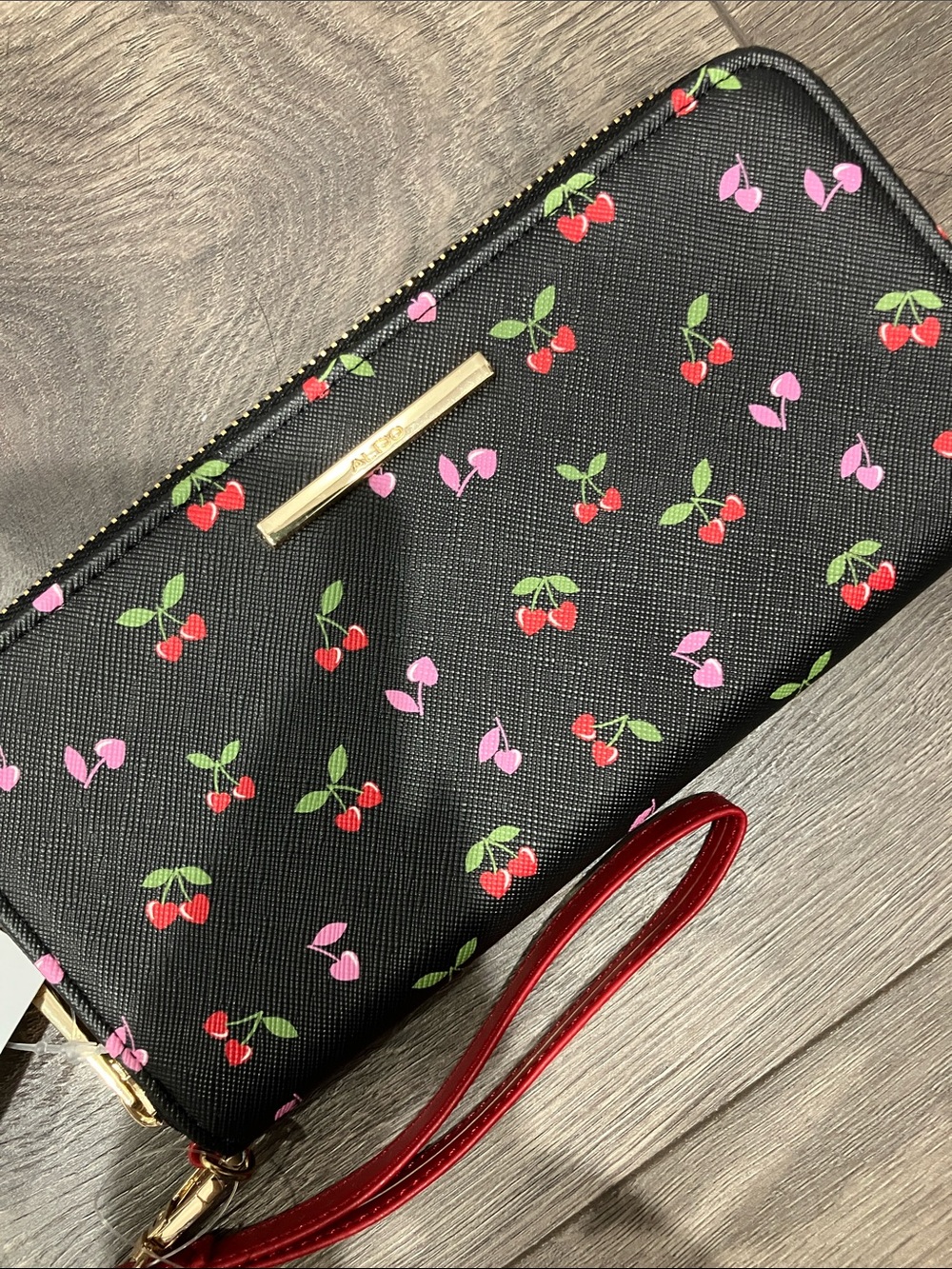 NWT. Aldo Black Cherry Print Wristlet with Red Strap, Zip Closure